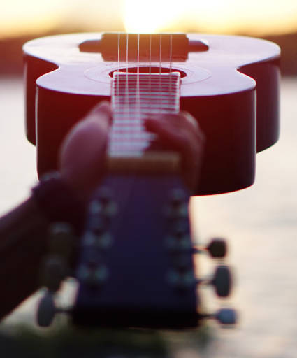 Guitar with a sunrise.